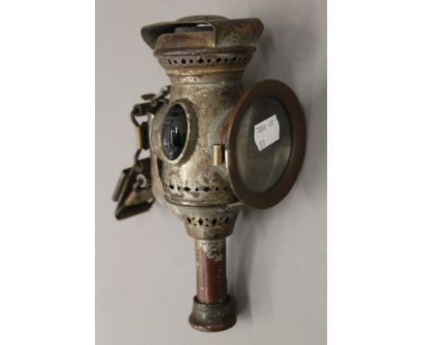 A vintage Miller cycle candle lamp. 20 cm high.