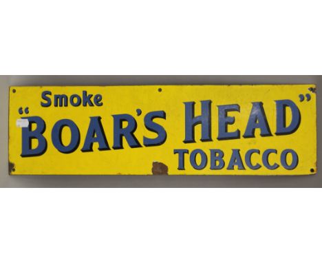 A Boar's Head Tobacco enamel sign. 61 cm long.