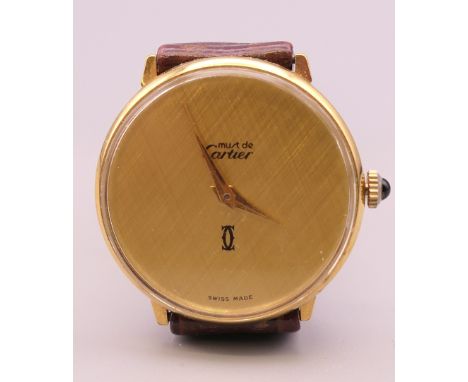 A Must de Cartier 18 K gold electro plated wristwatch. 3 cm wide.