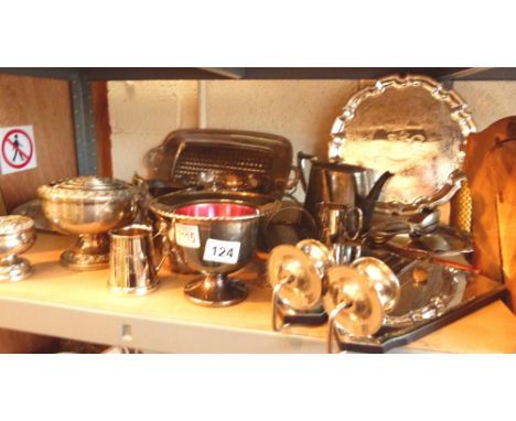 Shelf of assorted plated metalware, including a rose bowl, platters, teapot etc