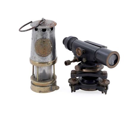 A Stanley London theodolite, no. 39040, 24cms; together with an Eccles Manchester Protector miner's lamp. (2)