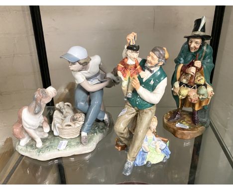 TWO ROYAL DOULTON FIGURINES ''THE PUPPETEERIST'' &amp; ''THE MASK SELLER'' WITH A LLADRO FIGURINE