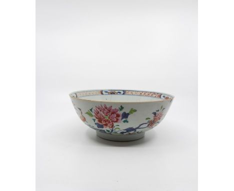 Three Chinese famille rose bowls; the first made for the export market, underglaze blue outlines, rocks, fence and boughs wit