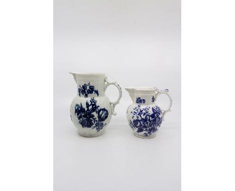 Two Worcester jugs, three flowers pattern, both with mask spout, the larger one Height 18 cms, spout restored, the smaller ju