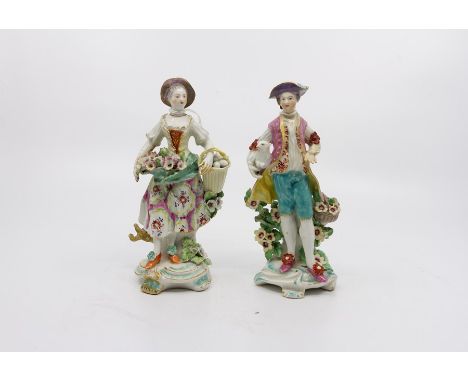Pair of Derby figures of Shepherd and Shepherdess, he holding a lamb and she holding a basket of eggs. Date c. 1775. Size 8cm