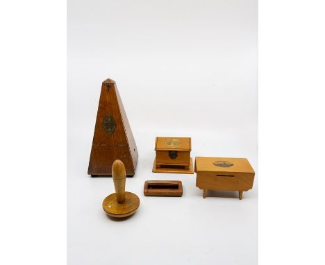 A metronome, three pieces of mauchline wear and a treen matchstick holder