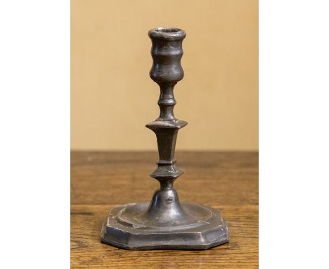 A small early 18th Century pewter taper stick