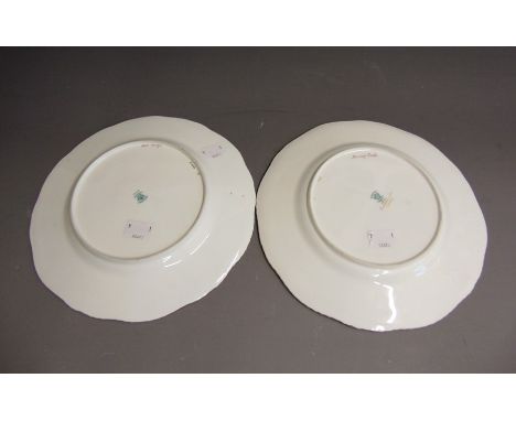 Two Coalport Cabinet plates, cobalt blue ground with intricate raised gilding, the centres painted with landscapes, along wit