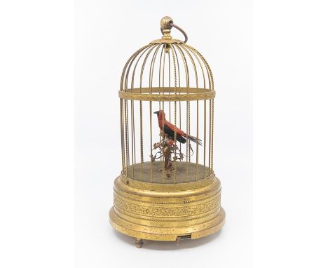 A 20th Century German gilt metal bird cage&nbsp;automaton, the red and black 'bird' on a perch in a&nbsp;circular domed cage,