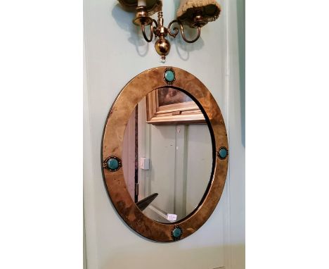 An iconic Liberty and Co brass and copper-framed mirror with 4 Ruskin turquoise ceramic cabochons. Original Liberty Label on 
