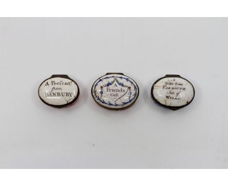 Two late 18th Century Bilston enamel oval patch boxes, circa 1770, one pink, the other blue enamel, each with a motto to the 
