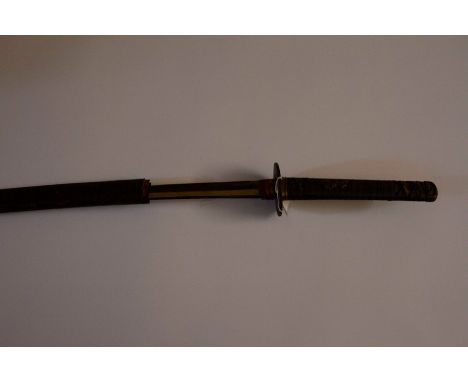 Japanese Katana Sword with 63cm long blade. Tang in unsigned. Bronze Tsuba. Cloth bound rayskin grip. Overall length 85cm. Wo