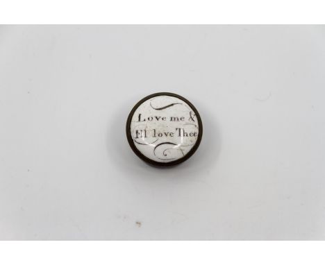 A small circular Bilston enamel patch box 'Love me and I'll love thee' approximately 2.3cm. diameter. (two small chips to ena