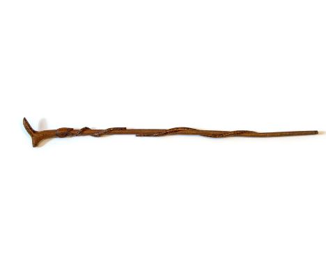 A walking stick with a carved ducks head handle, shaft has diced design with two stained and varnished entwined snakes.&nbsp;