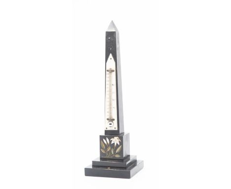 A thermometer mounted onto a slate obelisk 