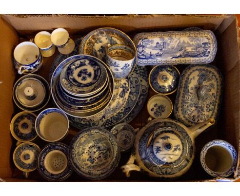 A box of blue and white ceramics to included strainers, teawares, plates, mustard pots with covers etc