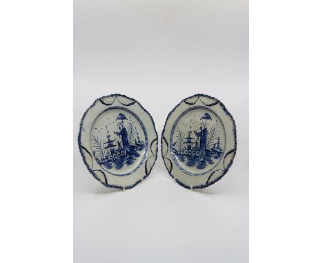 A pair of pearlware blue and white plates, late 18th Century, possibly Liverpool, blue feathered serpentine edge, in ‘Long El