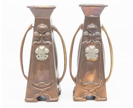 A pair of Art Nouveau copper candle stick with Prince of Wales feathers design&nbsp;&nbsp;