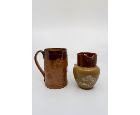 A collection of stoneware jugs, tankards and cups, mostly Doulton Lambether salt glazed, to include large jug measuring 27 cm