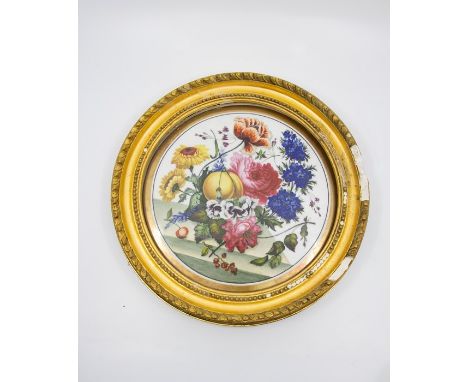 A pair of 19th century painted porcelain plaques with floral and fruit still life images surrounded by deep gilt boreder, fra