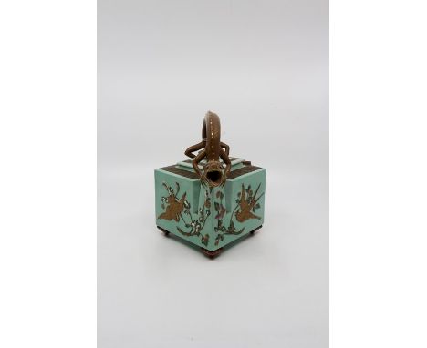 A late Victorian Aesthetic cube teapot, light green ground with birds including golden crane swooping amongst foliage, chilli