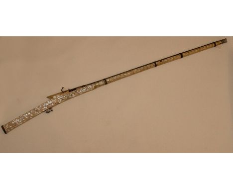 An Indian XX bore matchlock Jazail with sighted barrel, length approx 122cm , flared at the muzzle, the entire full stock ove