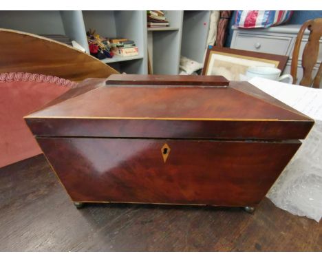 A Regency inlaid mahogany sarcophagus shape tea caddy, raised on bun feet, 18h x 29w x 17cmdLocation: 4:1 