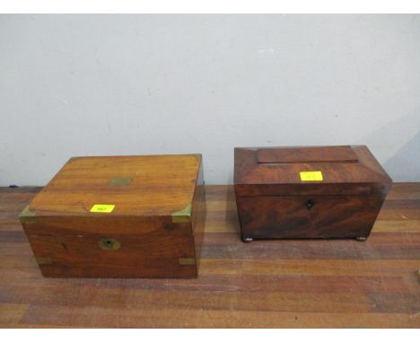 A Regency rosewood sarcophagus shaped tea caddy with fitted compartments and later porcelain mixing bowl on bun feet, and a 1