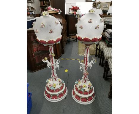 A pair of Capodimonte ceramic floor lamps with globular glass shades and floral decoration 119cm h A/F Location: RWF 