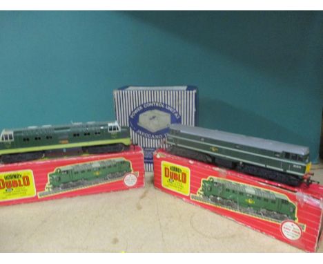 A Hornby Dublo 2232 Co-Co Diesel electric locomotive and two locomotive boxes together with a Triang engine and a Meccano Ltd