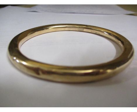 A 9ct gold bangle, 9.9g (Condition: Various dents)Location: Cab 