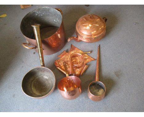 A Victorian large copper twin handled cooking pot, a large copper kettle with star design to the lid, an Art Nouveau crumb tr