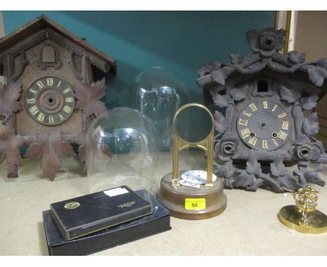 A G.S. Tiffany electric clock stand and enamel dial A/F, two early 20th century German cuckoo clocks A/F, two glass domes and
