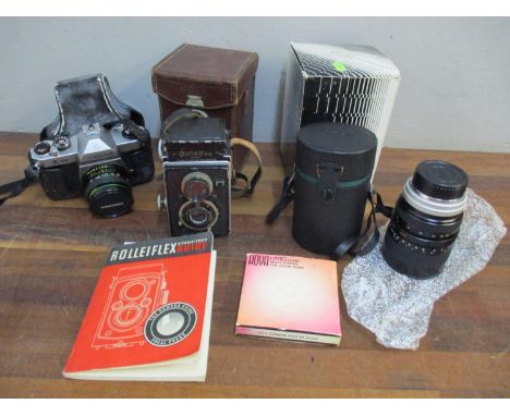 A leather and Rolliflex, a Hoya lens, and a Pentax Asahi K1000 camera 