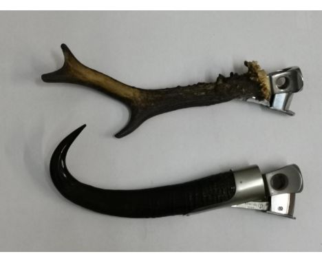 Two vintage Solingen cigar cutters with horn handlesLocation: Cabs 