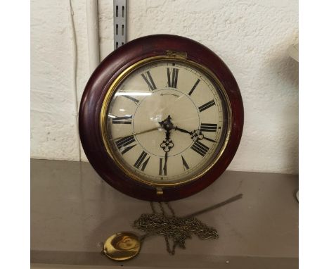 A late 19th/early 20th century mahogany cased wall hanging Postman's alarm clock, together with pendulum but no weights Locat