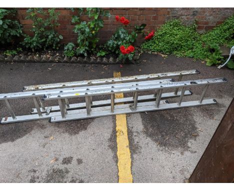 An aluminium three-section ladder Location: G 