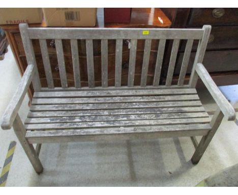 A teak garden bench 87cm x 122cm x 55cm 
