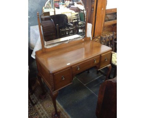 A MAHOGANY KNEE HOLE DRESSING TABLE WITH MIRROR