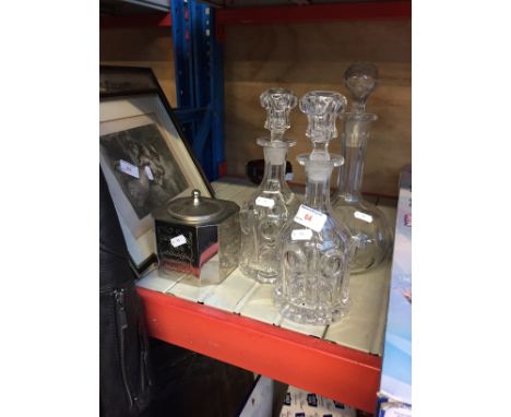 THREE GLASS DECANTERS, METAL TEA CADDY ETC
