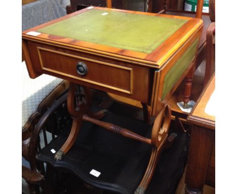 A YEWOOD OCCASSIONAL DROP LEAF TABLE WITH LEATHER TOP H52CM W46CM D38CM