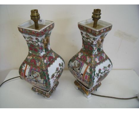 Pair of oriental ceramic table lamps of square bulbous form on raised bases (height 40cm) 