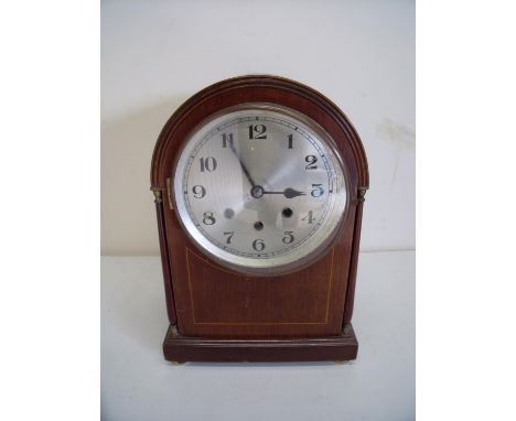 Edwardian mahogany inlaid arch top steel faced chiming mantle clock on raised bun feet, the movement stamped 60143 