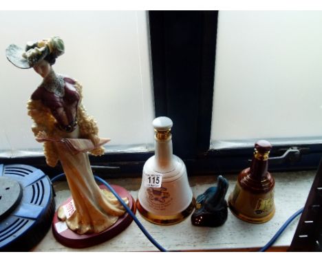 Tall Carnival figurine and two Wade whisky bells and a Poole seal 