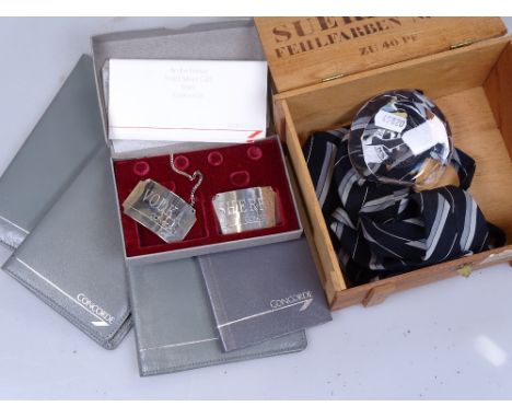 Concorde memorabilia, including passport wallets, silver decanter labels and a signed photograph of the last Concorde flight