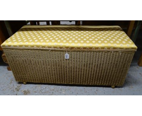 A Vintage gold and upholstered Lloyd Loom ottoman, L90cm 