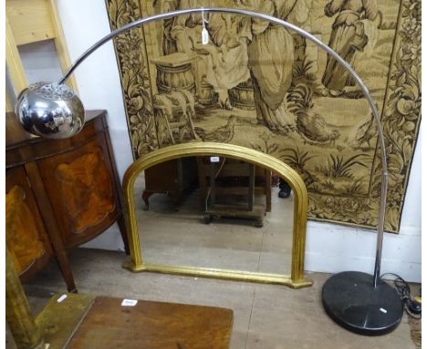 A floor standing chrome arc lamp 