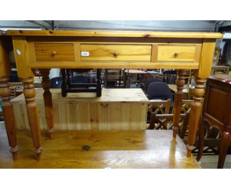 A modern rectangular pine side table, with 3 frieze drawers, on fluted legs, L111cm 