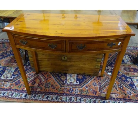 A reproduction cross-banded yew wood side table, of bow-front form, with 2 frieze drawers, raised on square tapered legs, W90