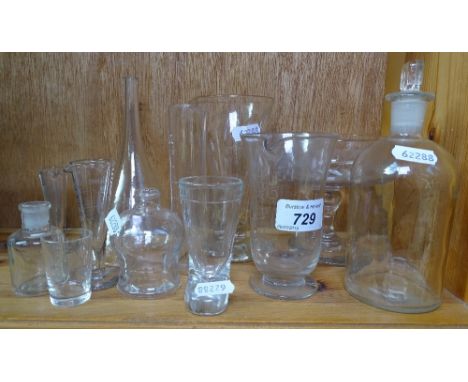 A decanter, measuring cups etc 